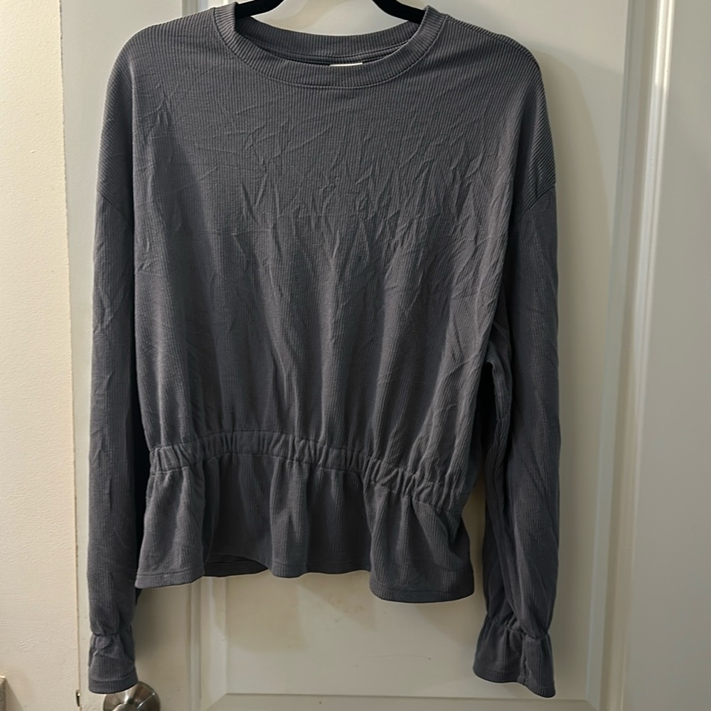 Ribbed peplum long sleeve top